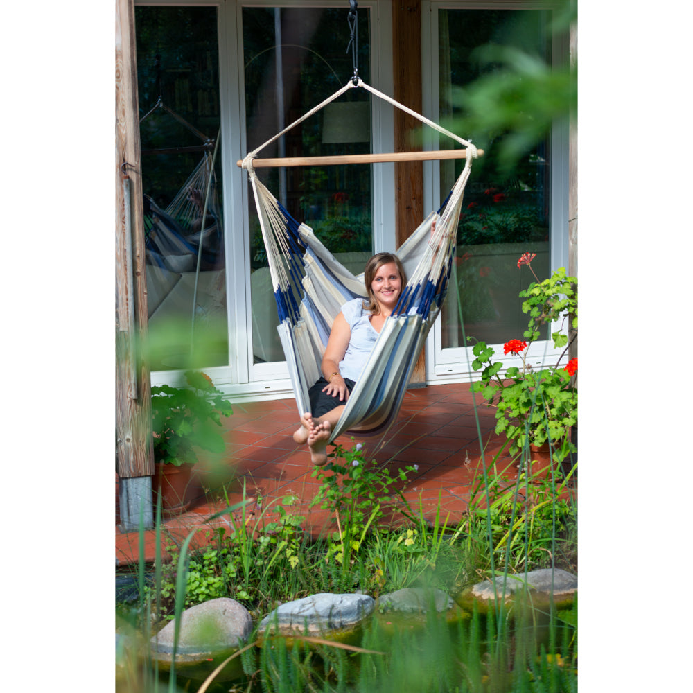 Hammock Chair Hung in Garden from Overhead Beam