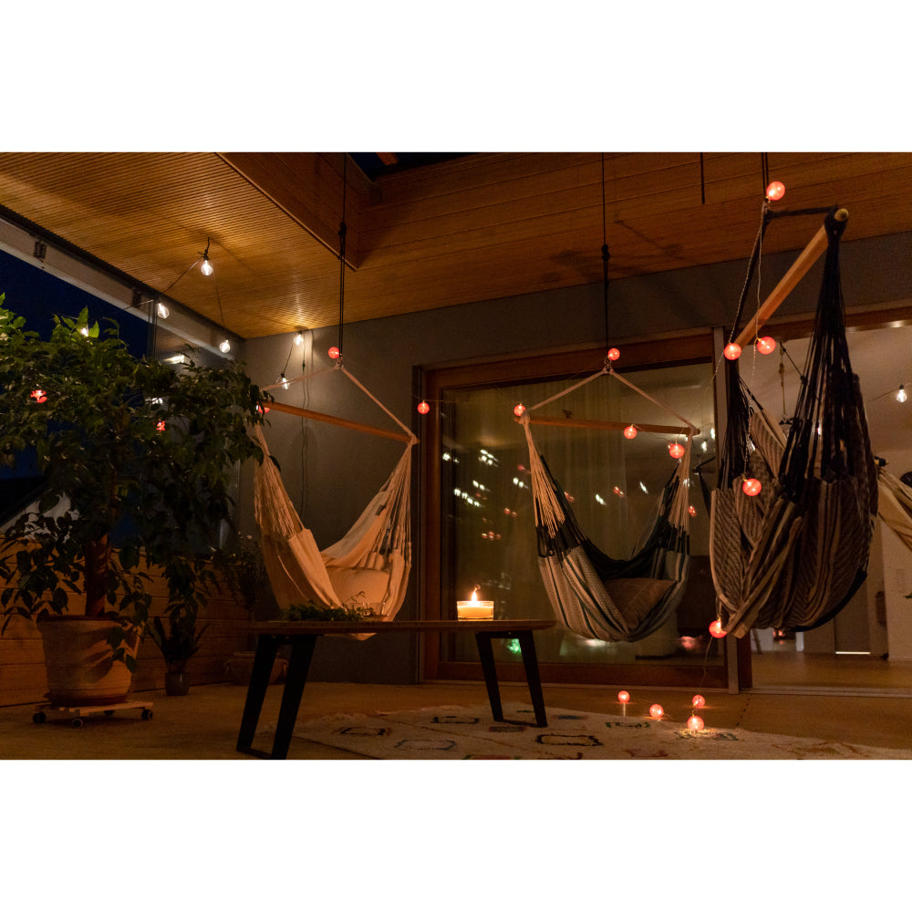 Hammock hanging outside undercover with colour surrounding lights