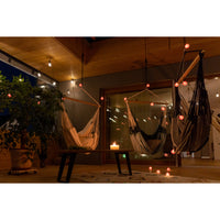 Hammock hanging outside undercover with colour surrounding lights