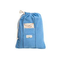 Blue drawstring bag with a small pocket on a white background