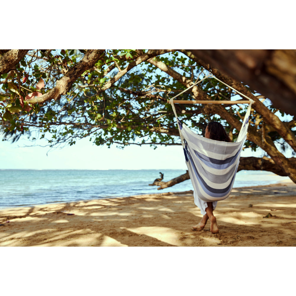 Hammock chair over looking a sandy beach