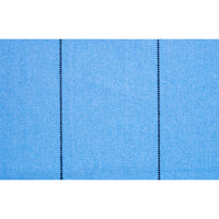 Close-up of blue fabric with a subtle pattern on a white background