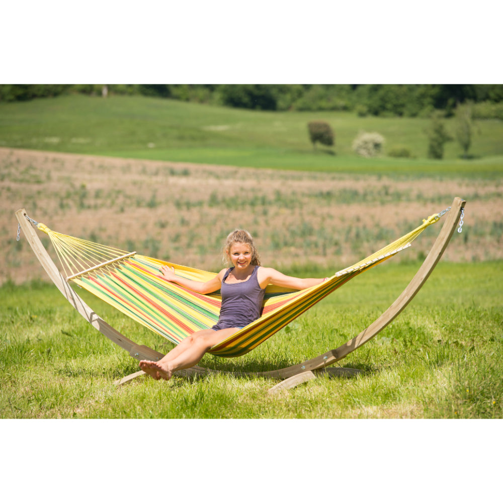 hammock on wooden frame in field