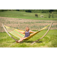 hammock on wooden frame in field
