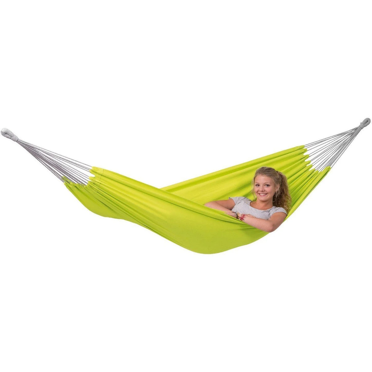 Person relaxing in a green hammock on a white background