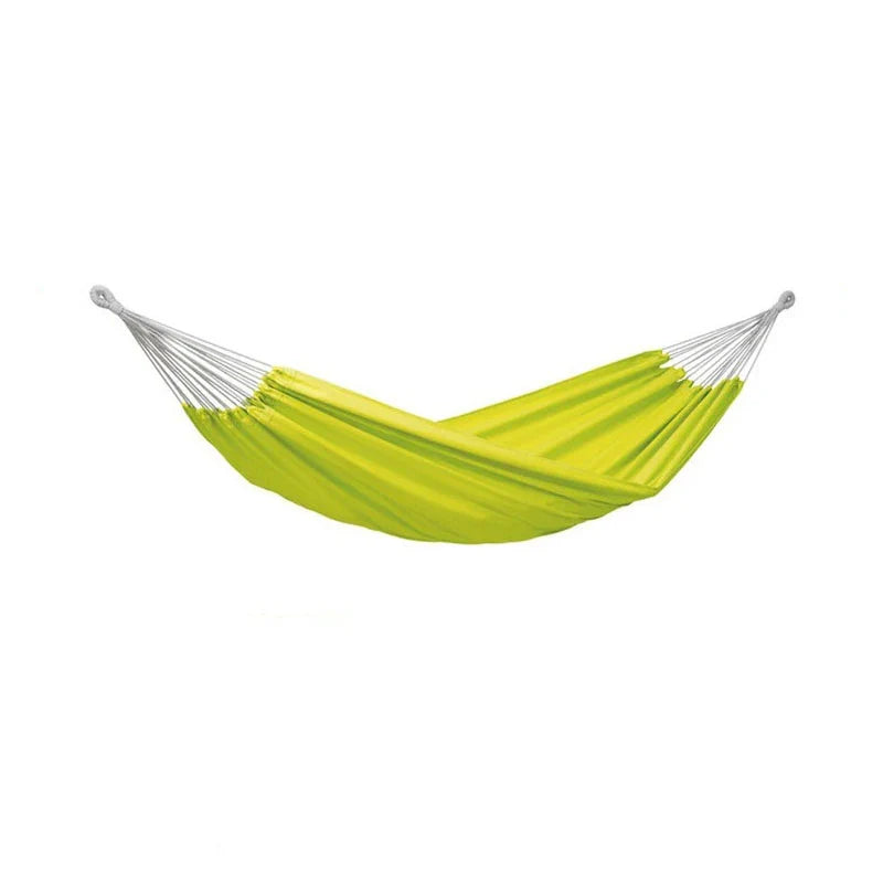 Yellow hammock with white ropes on a white background