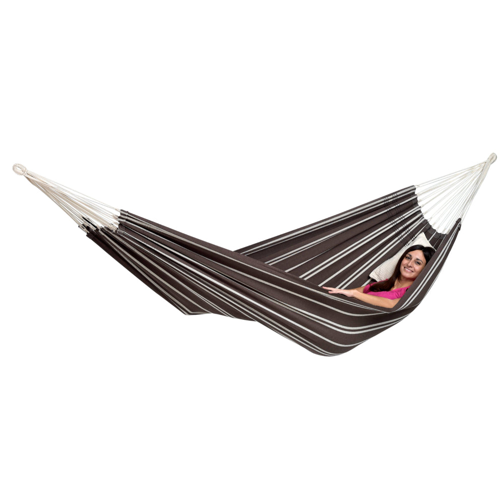 Brown and white striped hammock with a lying back in