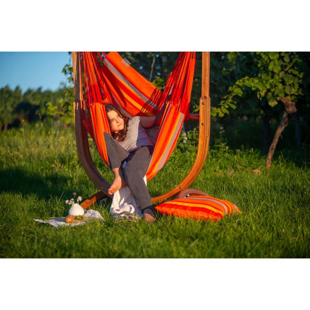 brightly coloured chair hammock in garden