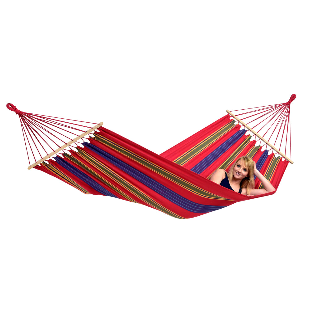 Colorful hammock with a person partially visible on a white background