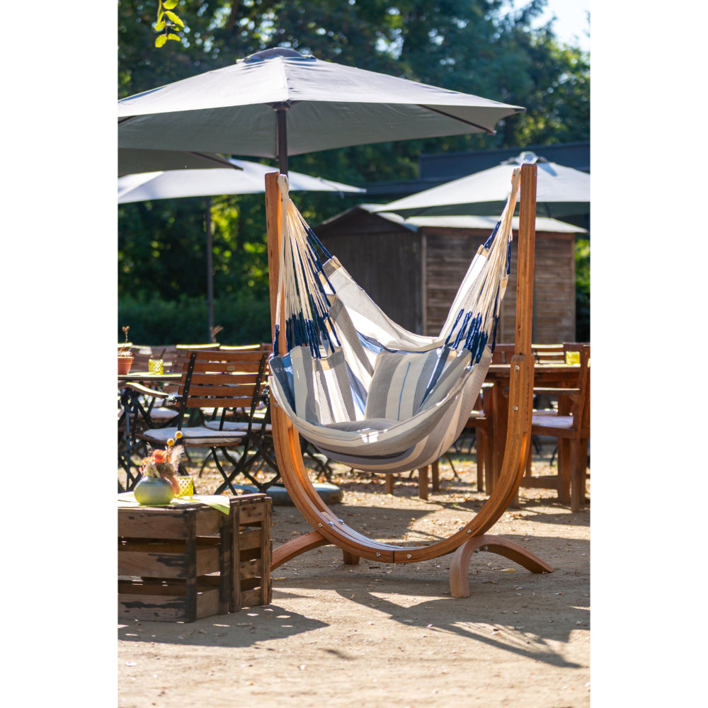 wooden hammock chair frame with hammock in outdoor setting