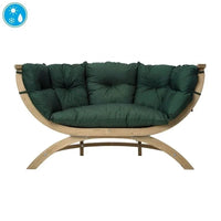 A curved wooden outdoor lounge chair with thick, tufted dark green cushions.