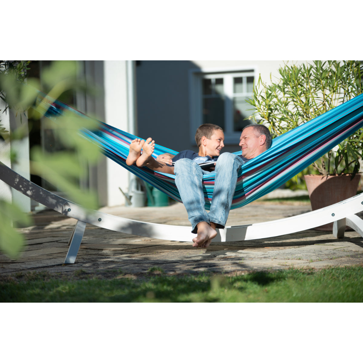 Father and Son Relaxing in Hammock