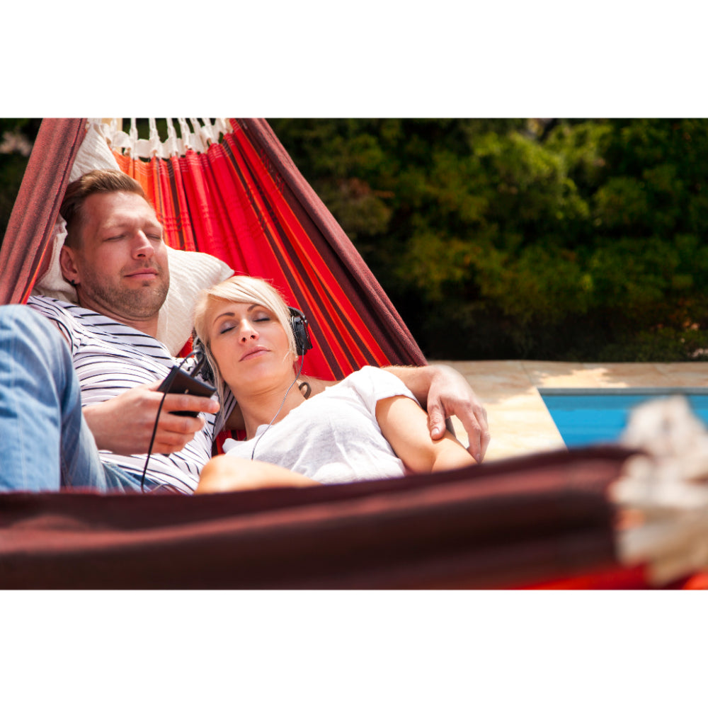 Couple napping in hammock