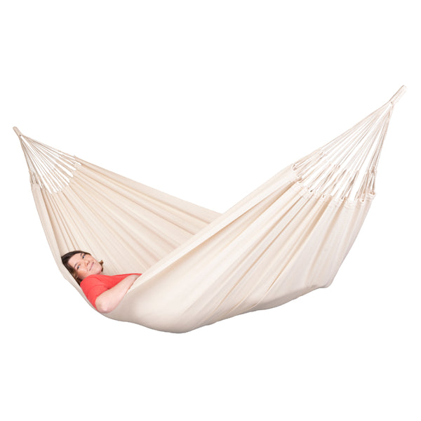 Resting in a white cotton hammock