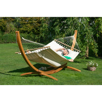 Wooden arc hammock stand and off-white organic cotton bar hammock