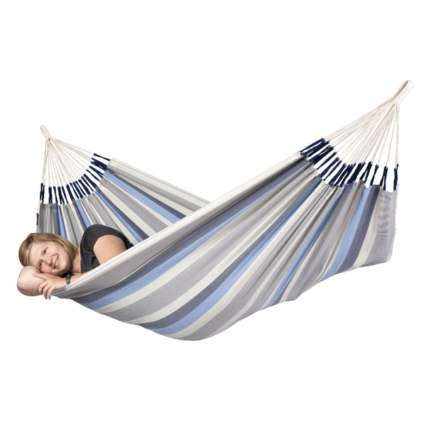 Woman relaxing in blue and white single size hammock